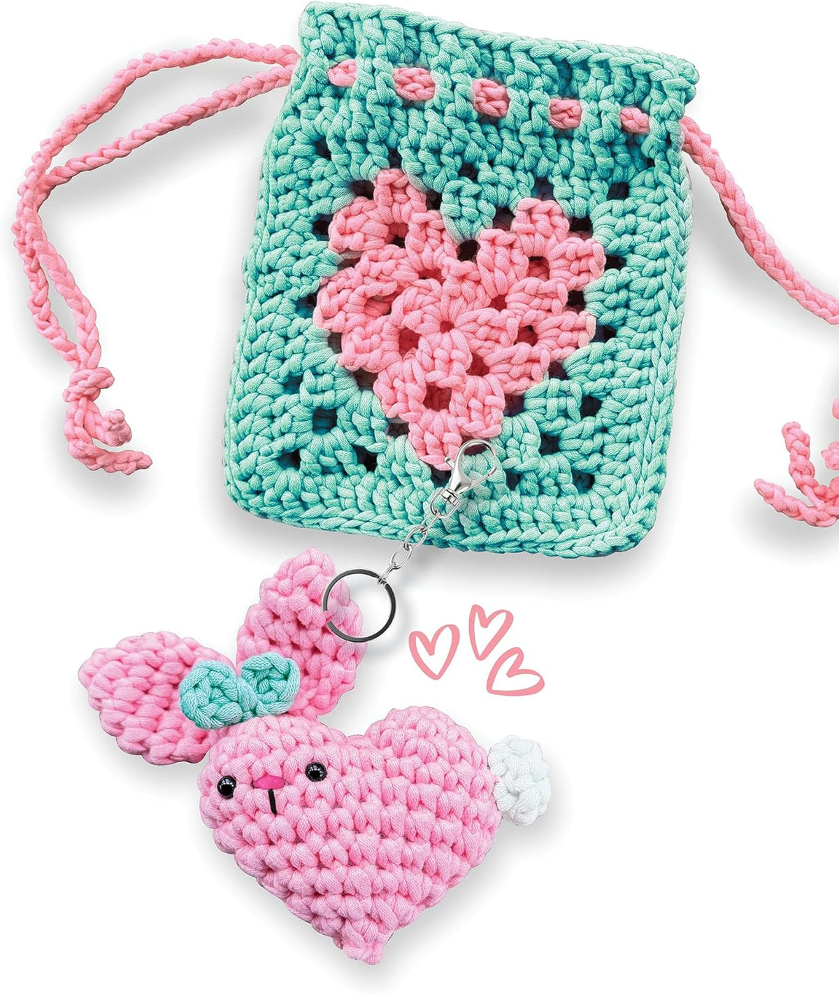 Crocheted heart-shaped pouch with pink heart keychain on a white background