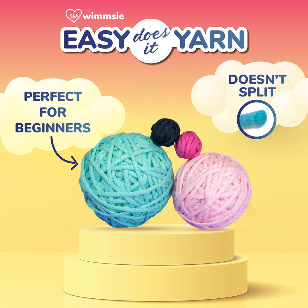 Wimmsie Easy Does It Yarn, showing two balls of yarn on a yellow pedestal against a pink-to-yellow gradient background. Text reads 'PERFECT FOR BEGINNERS' and 'DOESN'T SPLIT', with a small inset showing a blue yarn ball staying whole.

